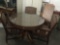 Vintage glass top oak dining table with 3 chairs & 3 leaves - vintage print of chairs