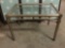 Vintage art deco glass coffee table with shapely metal frame - glass cracked on one corner of the
