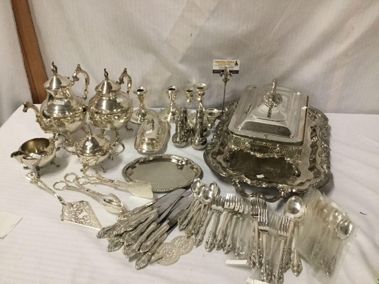 78 pc silver plate lot incl. candlesticks, teapots, silverware, cream and sugar, etc