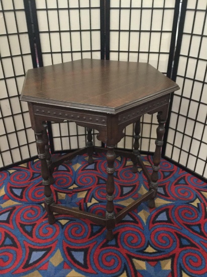 Vintage hexagonal side table with carved legs and side detail