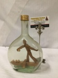 Vintage bottle with wooden bowler built inside