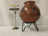 Clay vase with Native American style geometric designs and metal stand - unsigned