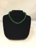 Fine necklace of dark green round jade beads