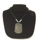 Carved black stone pendant of a standing tiger with beaded necklace