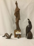 Lot of 3 carved wooden statues from unknown artist incl. a perched bird, a seal and an Asian figure