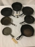 Seven vintage cast iron skillets ranging in sz from 6.5 to 10.5