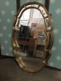 1976 opulent wooden wall mirror with gesso frame. Could use some cleaning, but otherwise in great