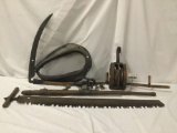 Collection of antique wood handled farm equipment - log puller, scythe, whip and more
