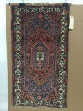 Hanging eastern rug with geometric and floral pattern