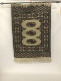 Hanging Eastern rug with geometric pattern