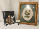 1 Goebel MI Hummel porcelain album from Galahad Books & 1 framed crocheted image of figures