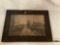 Antique print of a village street w/ ducks crossing in wood frame, artist unknown, approximately 26