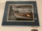 Framed photograph print of boats, signed by artist Bill McNeil, approximately 20 x 17 inches.