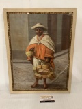 Framed antique canvas painting of a man with baskets, approximately 16 x 21 inches