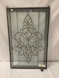 Stained glass style plastic window mounted in iron. Has crack.