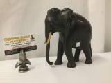 Ironwood carved elephant statue with bone tusks - body of the statue shows damage as is