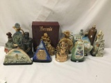 Collection of 13 vintage porcelain and stoneware collectible decanters.