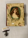 Antique photo album with metal latch and vinyl/velour cover binding, approx 9x11x3 inches