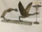 Metal sculpture art piece of two migrating Canadian Geese, signed by artist Roger Strong.