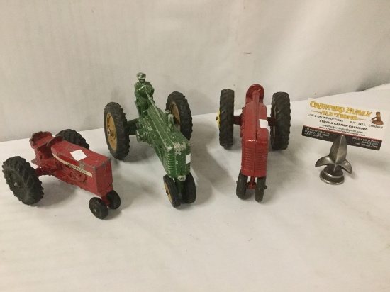 Three antique cast iron toy tractors: Hubley Kiddie Toy, Ertl,