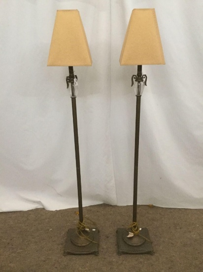 Pair of modern floor lamps w/ manilla shades and metal/glass decorative column