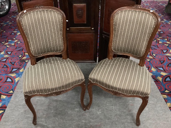 Pair of vintage wood carved chairs with flower design and upholstered seats