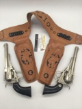 Pair of vintage mid century Hubley Remington .36 cap gun revolver pistols w/ leather holsters -