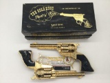 Rare pair of Schmidt Buckin Bronc Gold Rush Days of 49 24k gold plated cap gun revolver pistols.