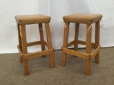 Pair of vintage rustic bar stools with leather seats and stud detail