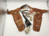 2 vtg cap guns incl. Leslie-Henry Texas Ranger revolver w/ original tag & Leslie-Henry 44
