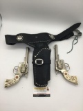 Pair of onstage Hubley Marshal cap gun pistols with black leather holster - both working