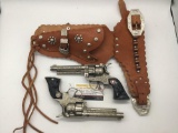 Pair of 40's Hubley Texan cap gun revolver pistols with real leather double holster - working!