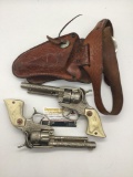 Pair of 40's Hubley Texan cap gun revolvers w/ white grips & with real leather double holster -