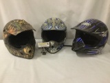 Three fiberglass and plastic off road helmets: camouflage Bell - DOT certified