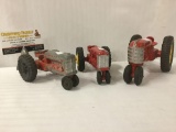 Three antique cast iron toy tractors: Hubley Kiddie Toy