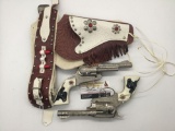 Pair of vintage Hubley Texan Jr die cast cap gun pistols w/ ornate stamped cowgirl holster
