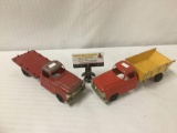 2 vintage red Hubley toy trucks incl. Hubley dumptruck & flatbed trucks - mild wear