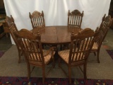 Vintage oak oval dining table with 2 leaves & 6 chairs by Spurry & Hutchinson w/ floral upholstery