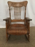 Antique tiger oak Americana rocking chair with sloped seat & stick/ball back as is