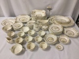 Lot of over seventy pieces of Spode Buttercup English China dinner service: cups, saucers, plates