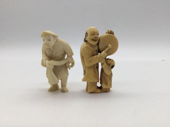 Vintage natural carved netsuke pendants of fisherman holding a net & man w/ drum signed