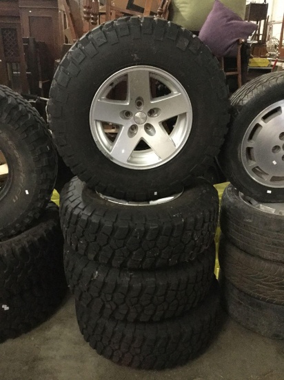 Set of 4 BF Goodrich Baja Champion Mud Terrain T/A Jeep tires with hubcaps