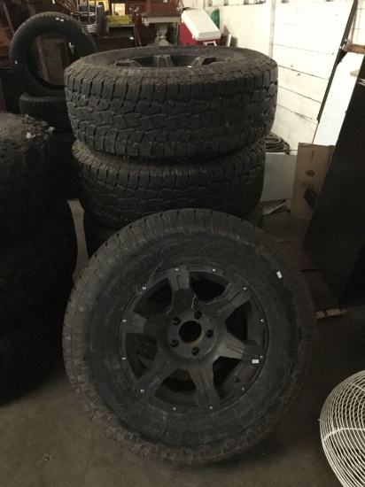 Set of 5 Toyo Open Country A/T II tires w/ matching hubcaps. 4 tires and a spare