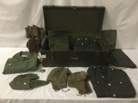 Vintage trunk full of small sized military clothing incl. 3 hates, 2 full uniforms, 2 sacks and
