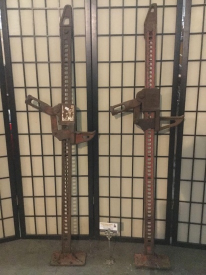 Pair of vintage mountable hydraulic jacks, one Ranch-Rite and the other brand is obscured