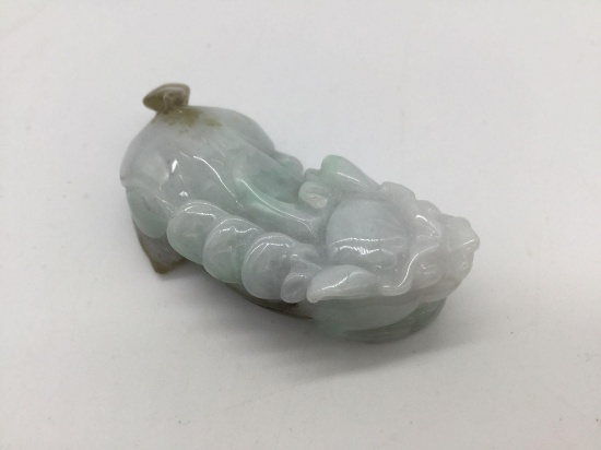Genuine carved Chinese light green jadeite foo dog with lucky coins
