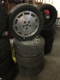 Lot of 4: 2 Dunlop SP Sport 5000 P225 tires and 2 Goodyear Eagle LS tires with matching hubcaps