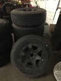 Set of 5 Toyo Open Country A/T II tires w/ matching hubcaps. 4 tires and a spare
