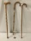 Three sturdy wooden canes, approx. 38x8x1.5 inches.