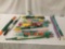 Twelve rolls of soft and polymer fabrics, approx. 36x6x6 inches.